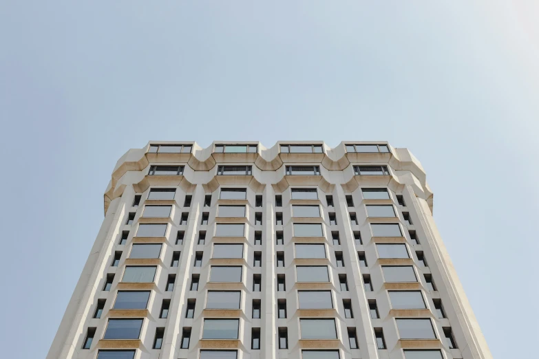 looking up at a tall building from the ground