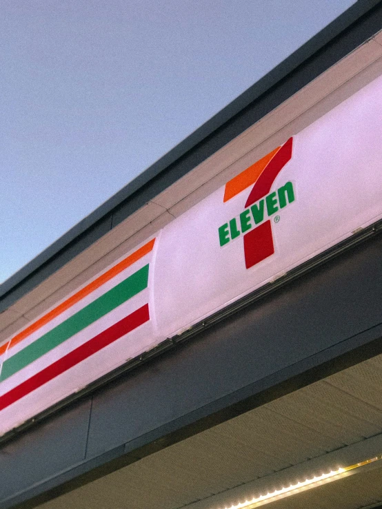 a 7 eleven sign is displayed on a store building