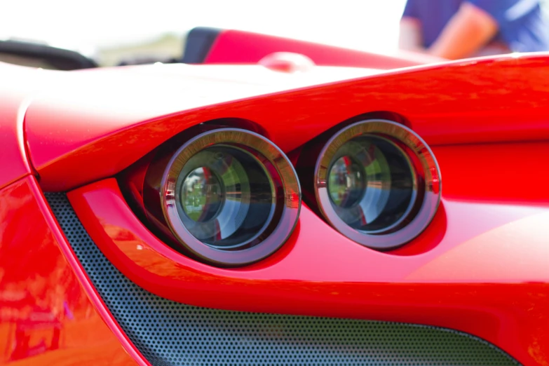 two light bulbs that are on the front end of a car