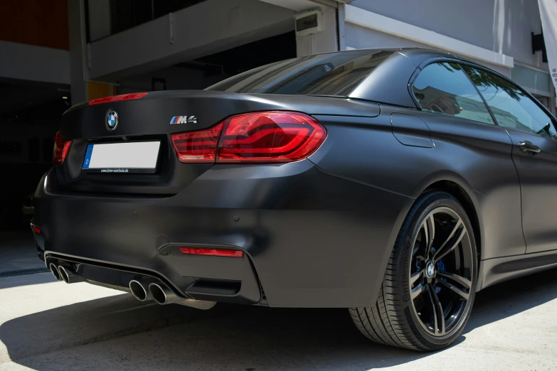 the back end of a gray colored bmw