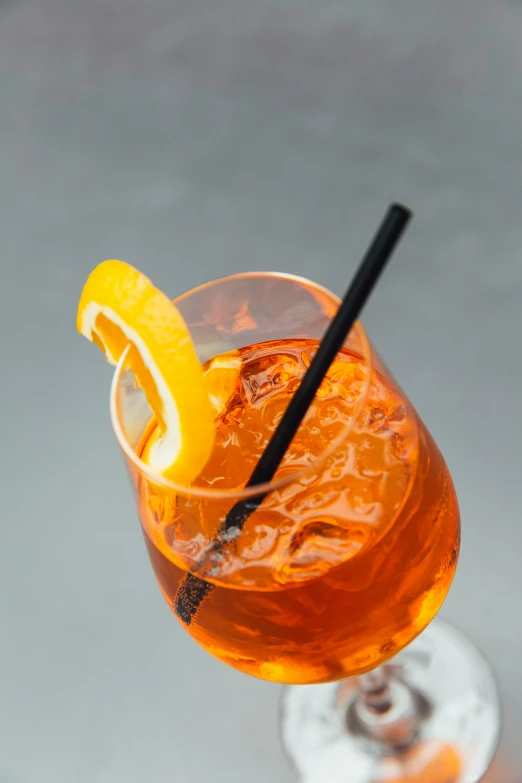 close up of a glass with a drink on the side