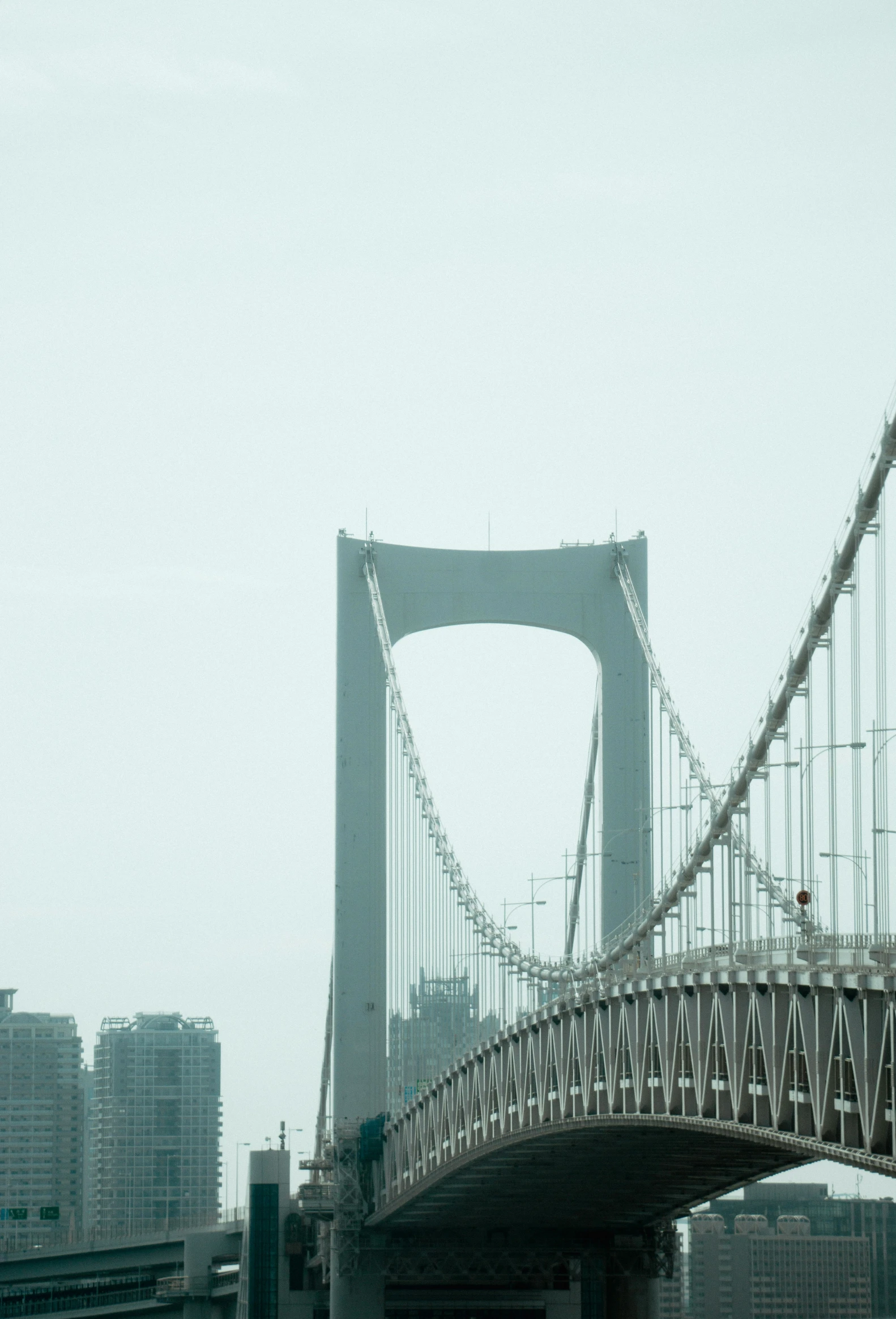 a bridge is shown against a hazy sky