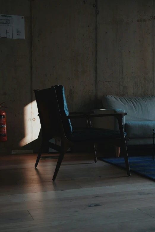 a living room with a couch and wooden flooring