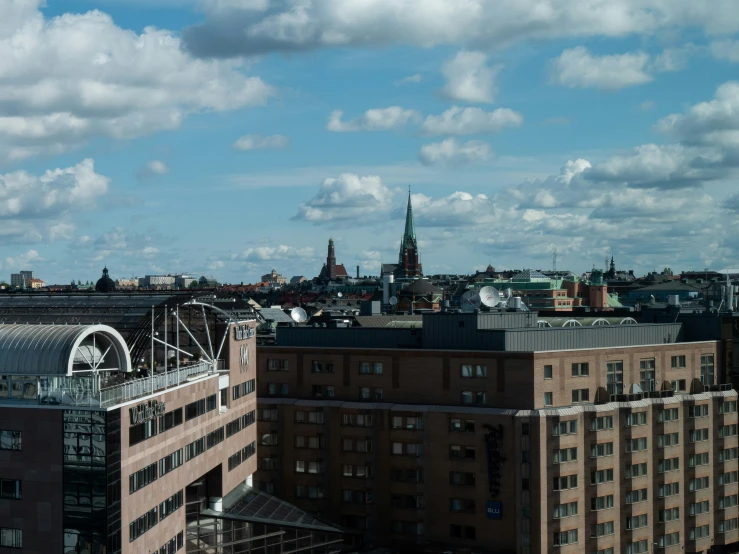 a city skyline with a clock tower in the distance