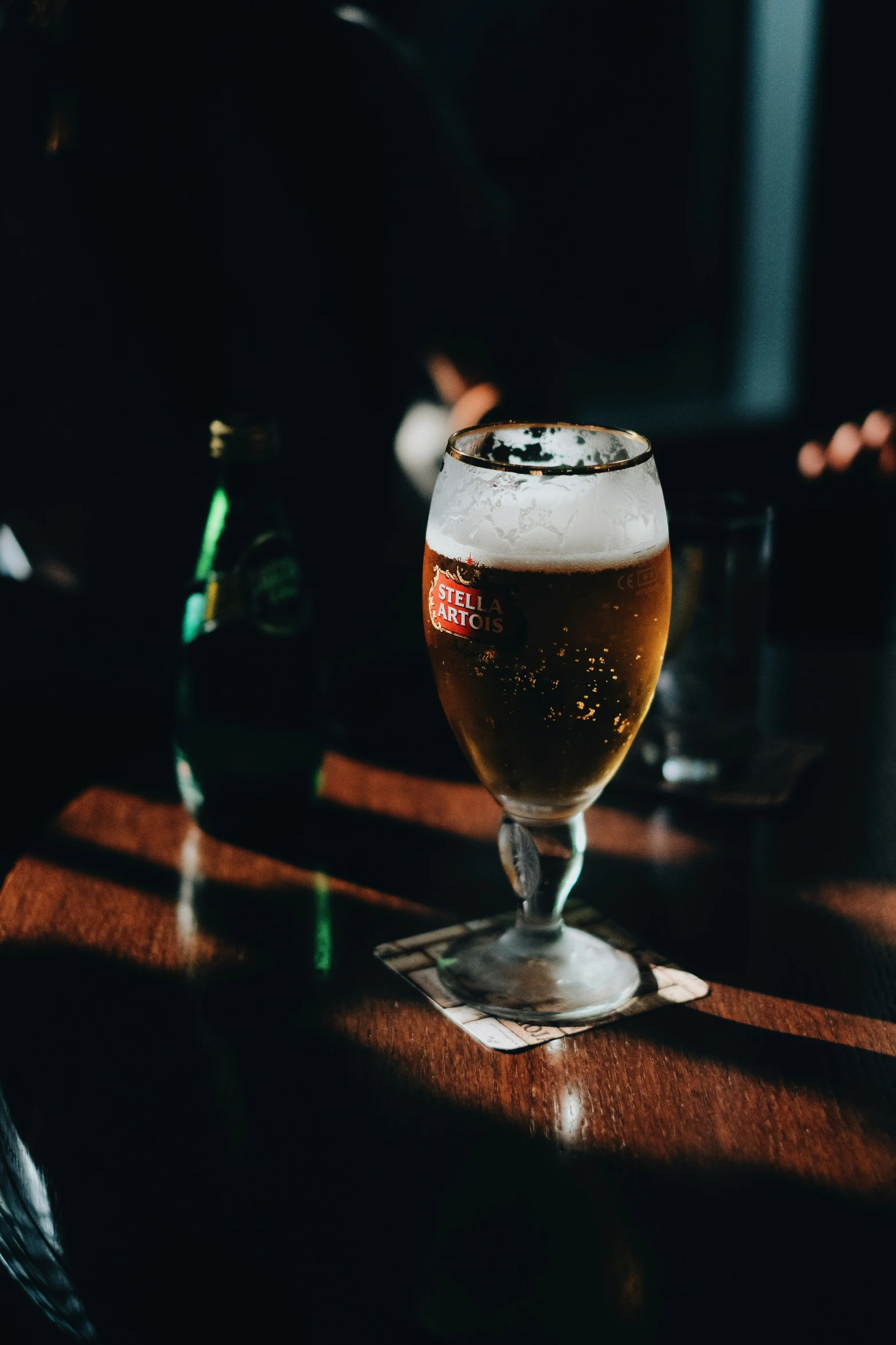 there is a person sitting at the table with beers in front of them