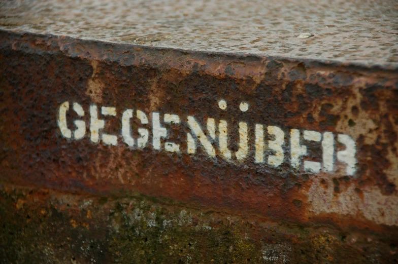 a rusty rusted piece of metal that reads georgetown