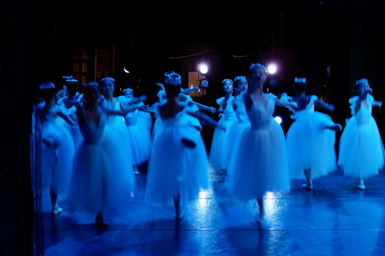 a bunch of ballet dancers are dressed for a show