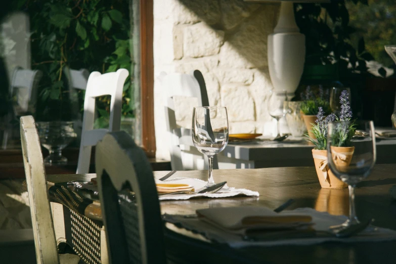 a dining room set with table cloths and chairs