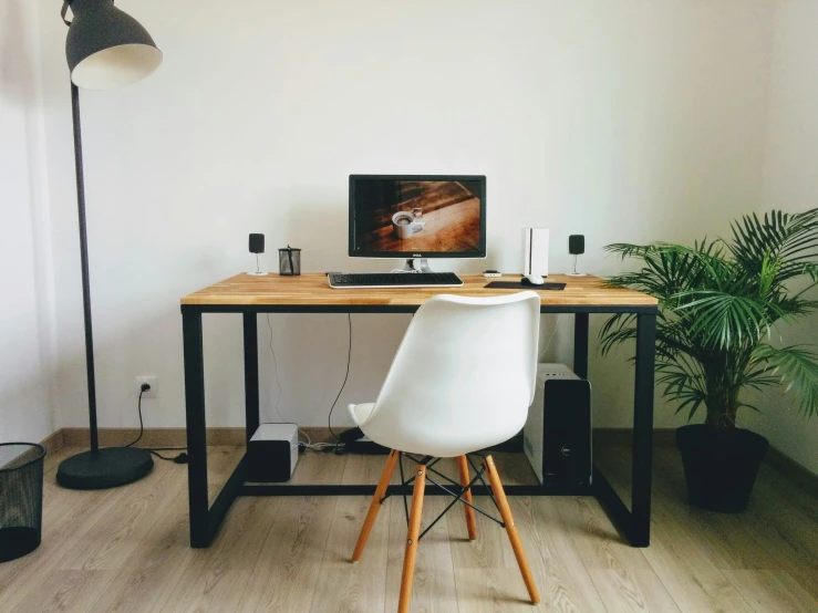 a large room with a computer on a desk