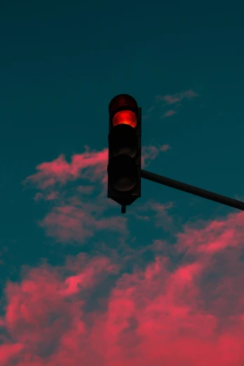 a traffic light with a sky background