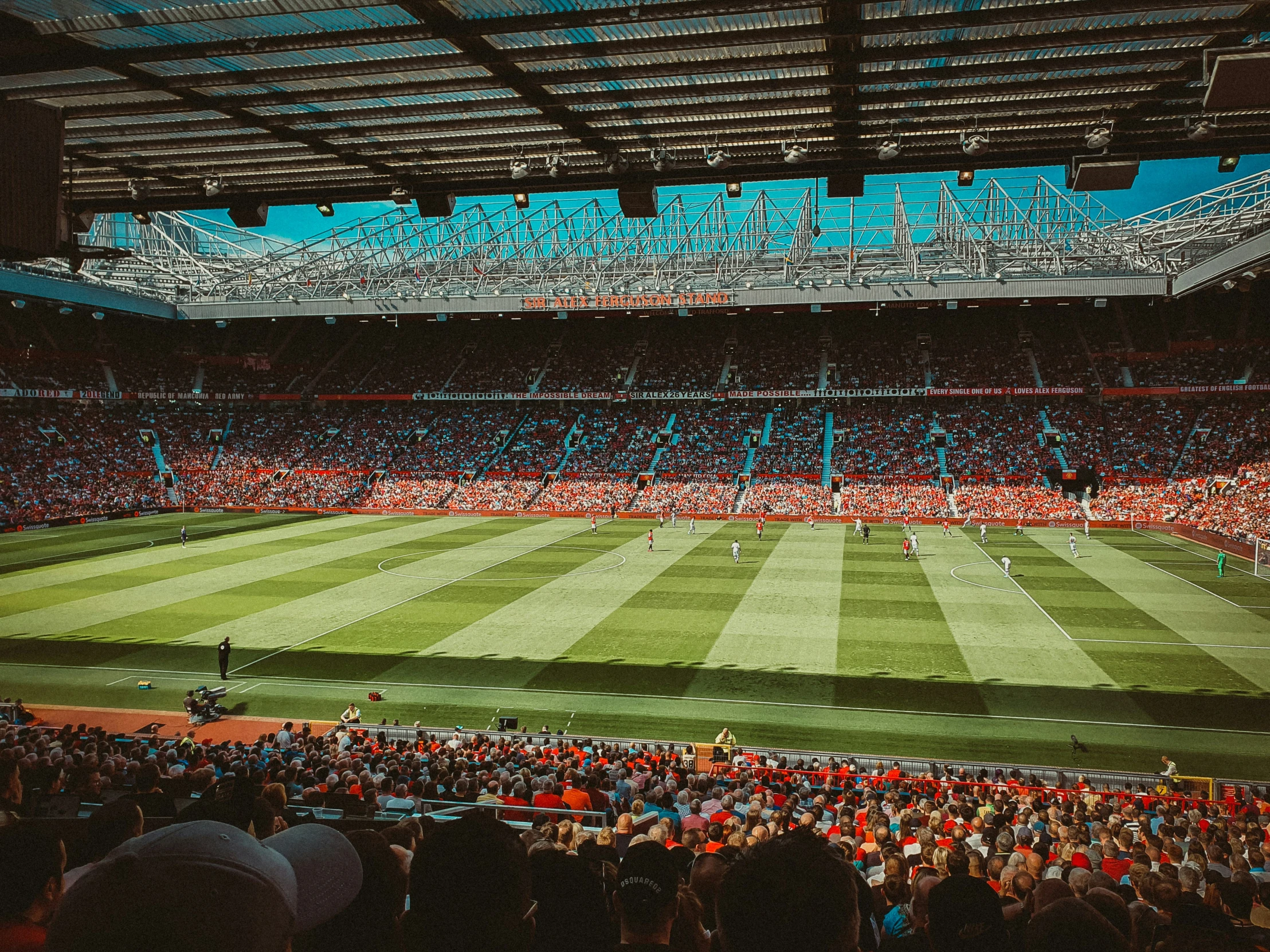 an empty stadium with a large crowd in it