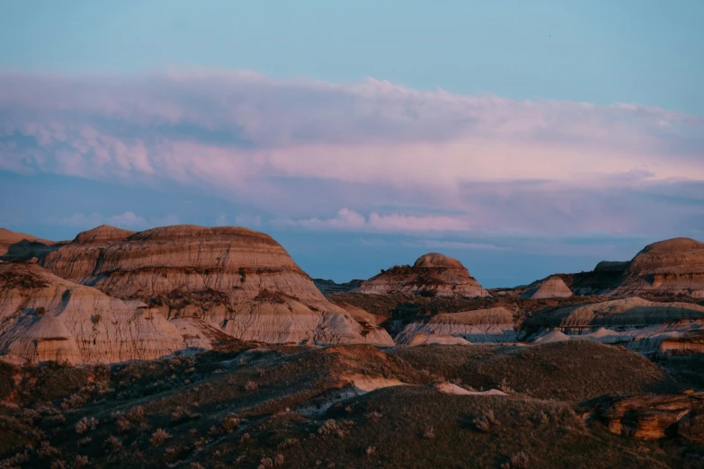 a scenic view of the mountains with different colored rocks