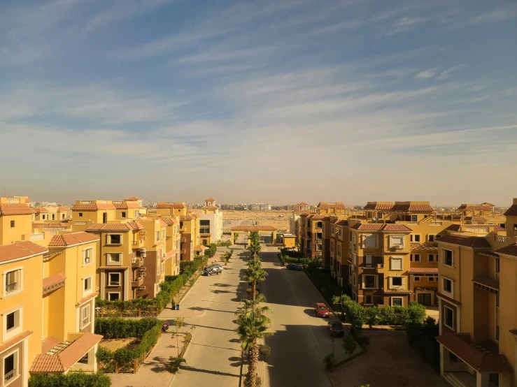 a street with buildings and some trees