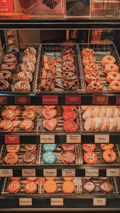 an assortment of various donuts for sale