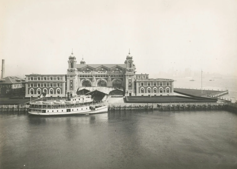 a very old po of a big boat near a very large building