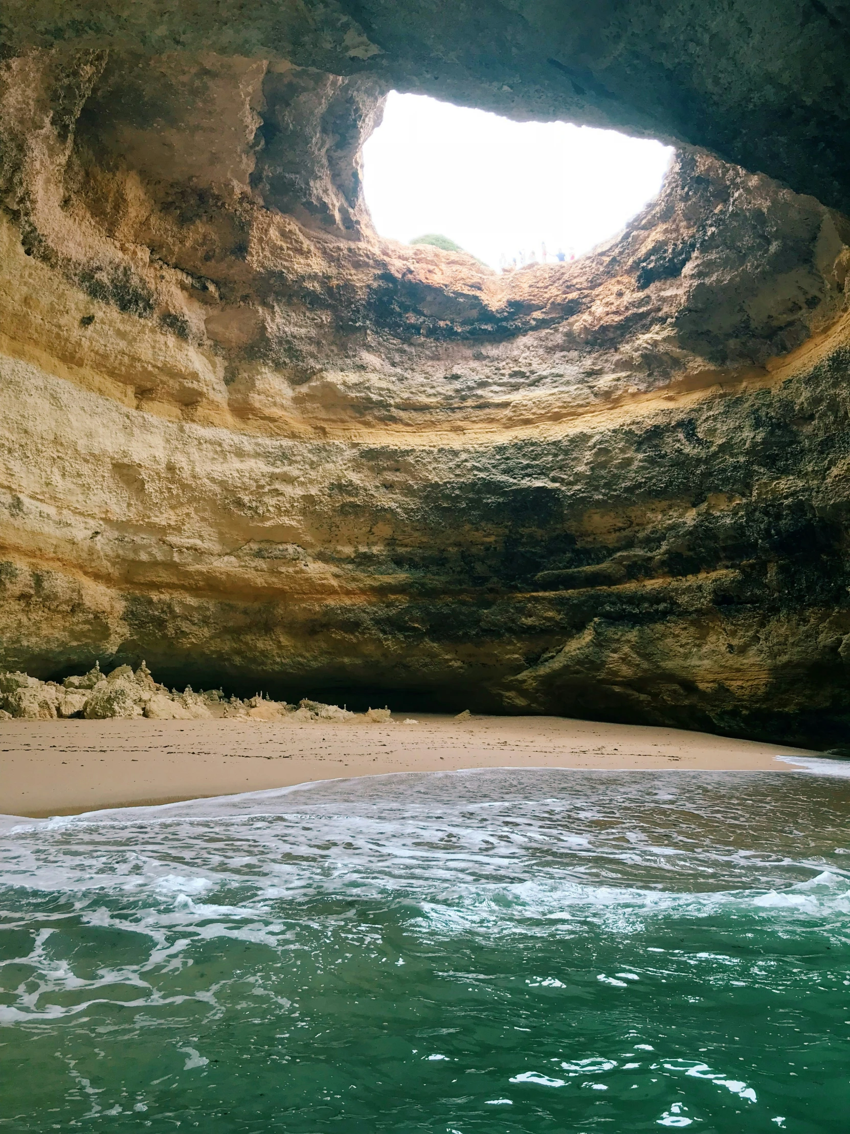 a cave that looks to be built on a beach