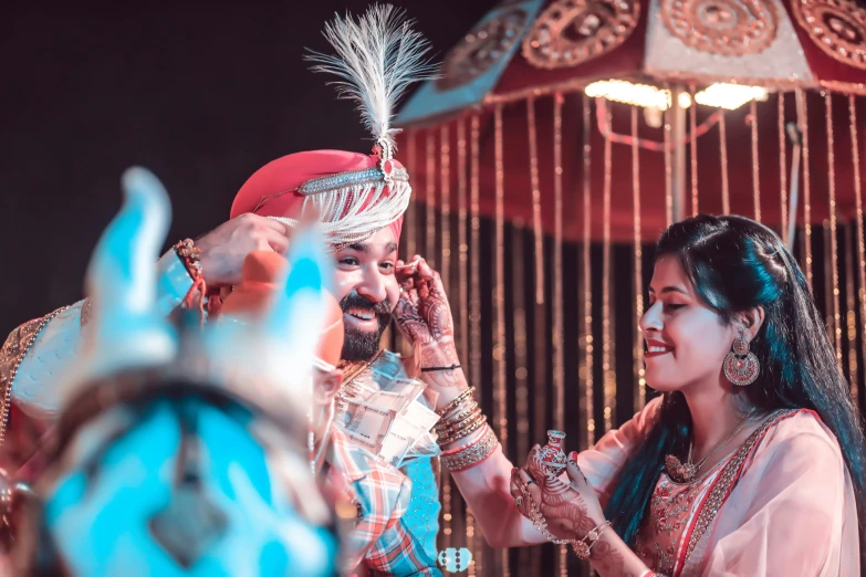 the man and woman are in the traditional indian ceremony