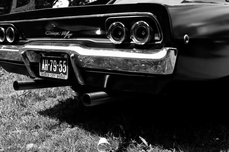 a black and white po of the hood of a classic car