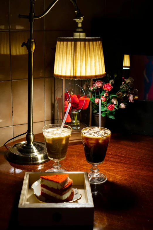 two glasses with a dessert on a table