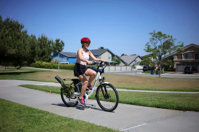 a person riding a bike in a neighborhood