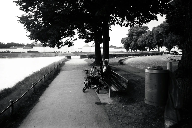 the black and white po shows two people on benches