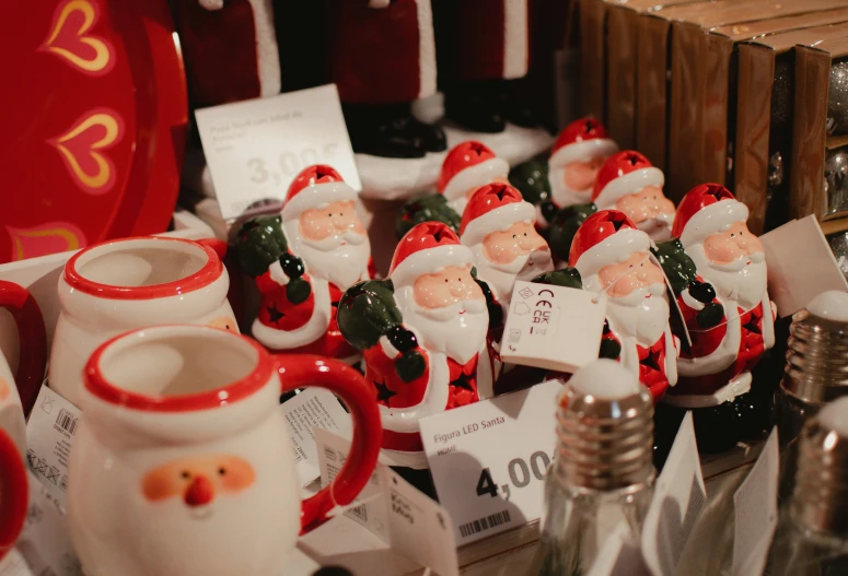 a pile of christmas decorations made with santa clause figurines