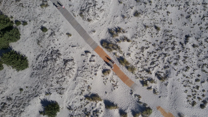 an aerial view of an area with a dirt road