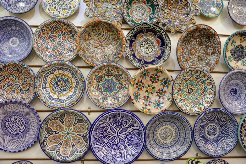 plates on the wall made out of ceramic tiles