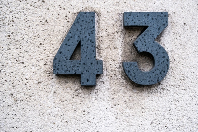 a black number twenty - five in concrete type with a white background
