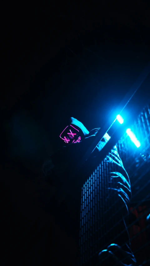 a traffic signal with green and blue lights at night