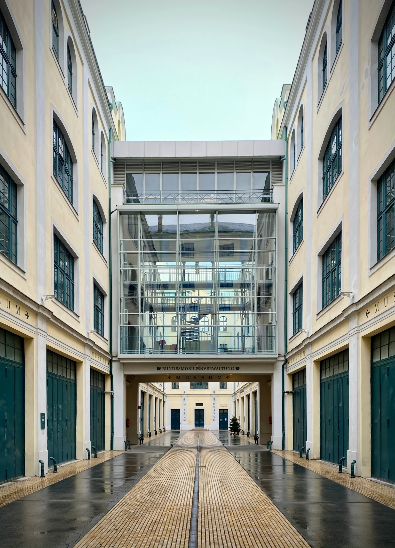 a walkway leading to an atrium between two building