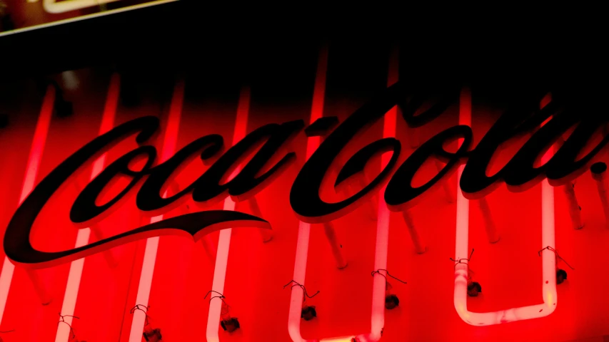 neon sign painted on the side of a building