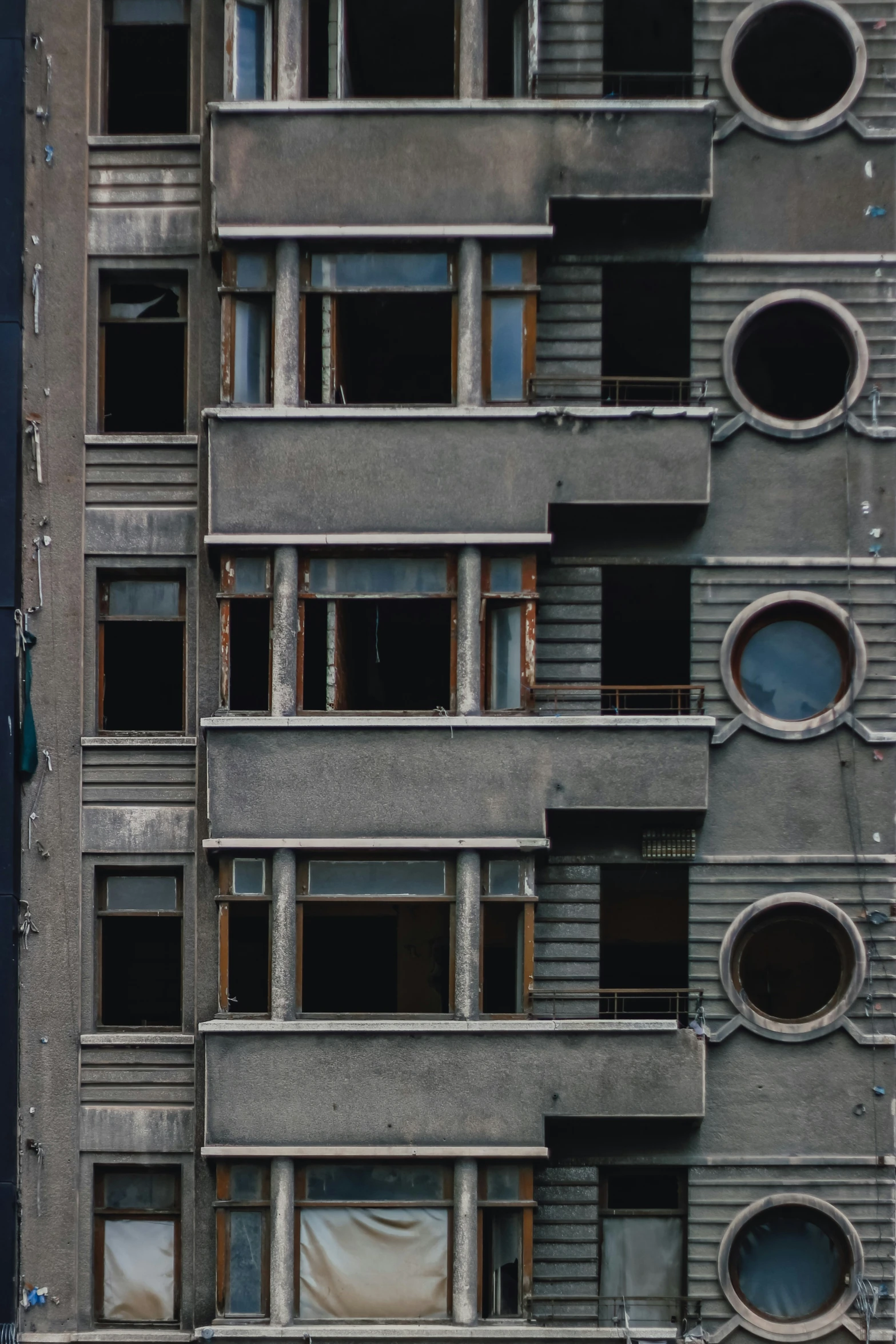 the facade of an apartment building with multiple openings and windows