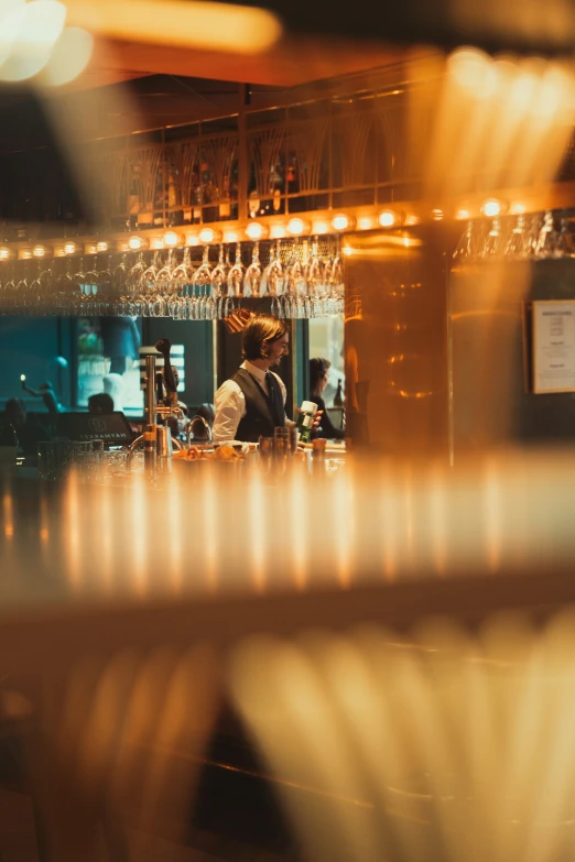 view through the window looking at a counter and wine glass