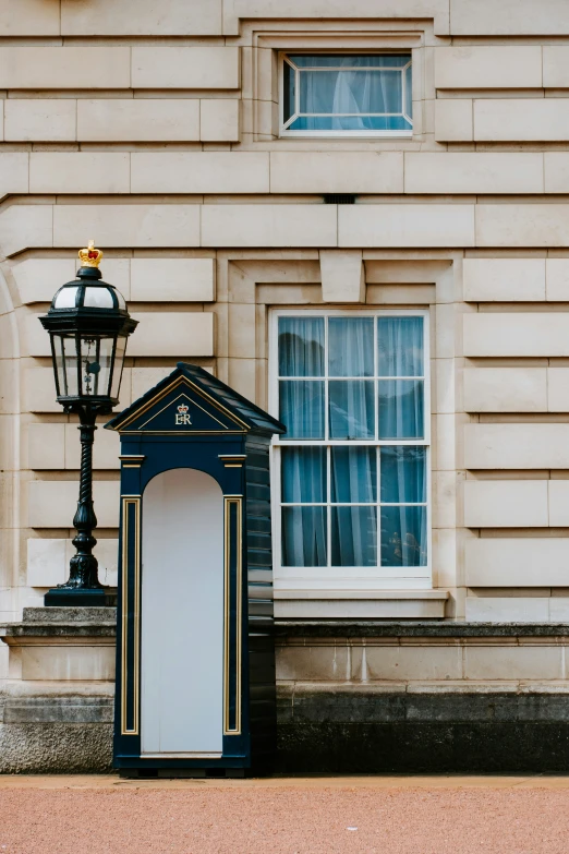 a blue light pole next to a lamp post