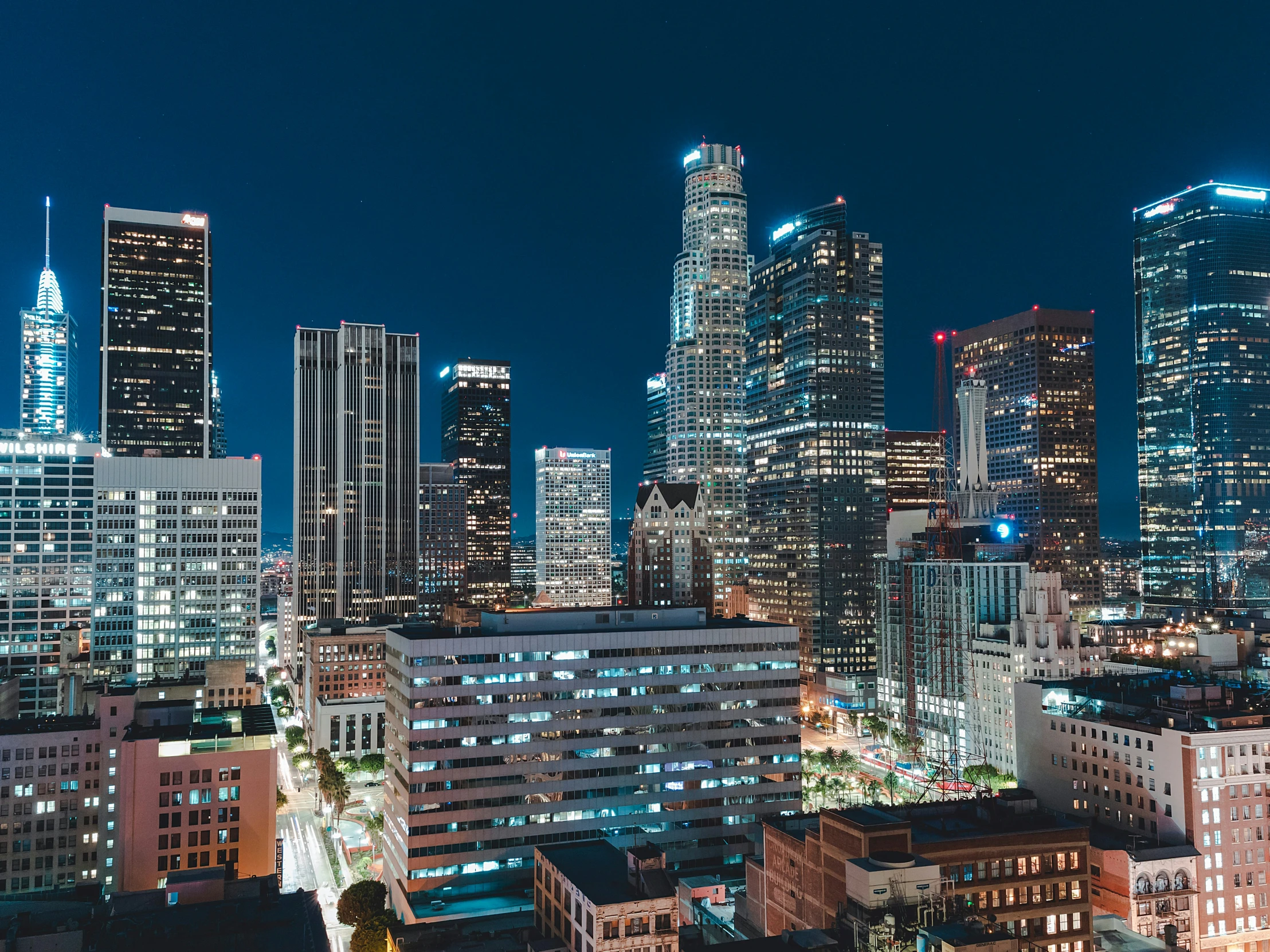 a cityscape at night as the sun sets