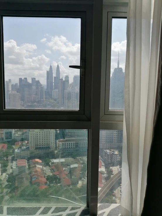 looking out of a window at a city skyline