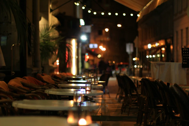 some kind of long table with many chairs and lights