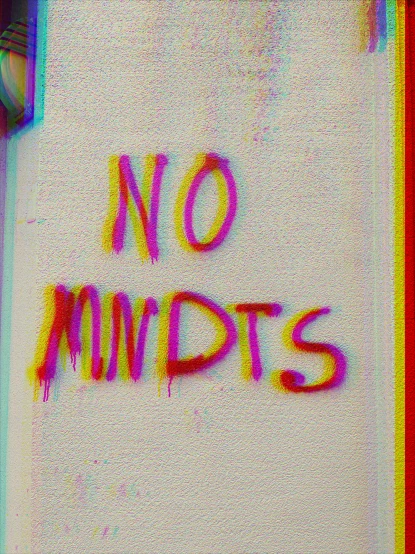 a no midants message painted on a white wall
