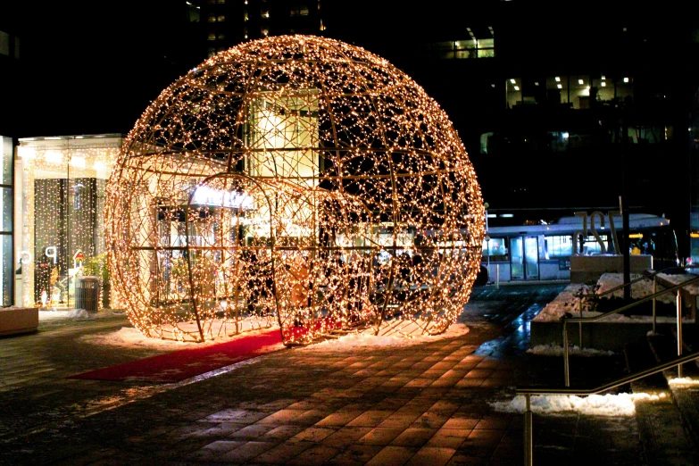 a structure that is covered in lights at night