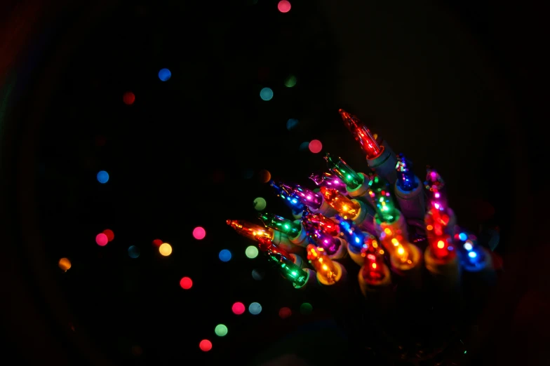 a set of multi - colored lights in the darkness