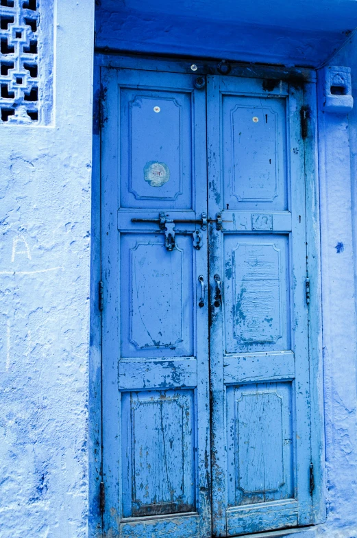 this is an old door that has been painted blue