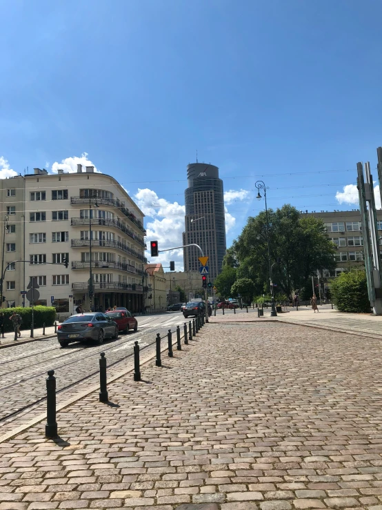 a city street filled with traffic under a blue sky