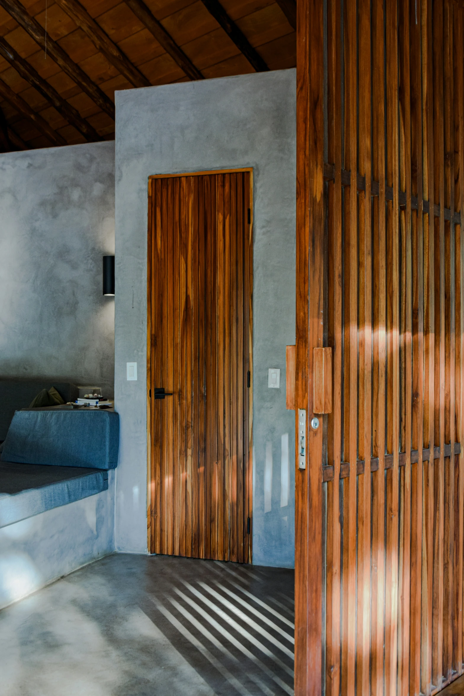 an image of a living room with wood paneling