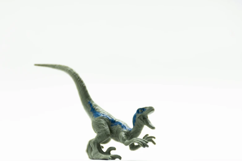 a dinosaur model posed with its head toward the ground