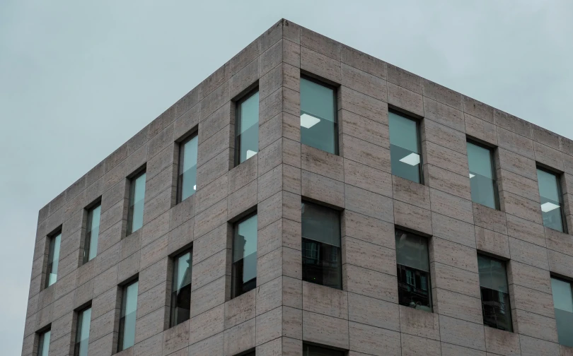 a tall building with many windows and lots of light shining on it