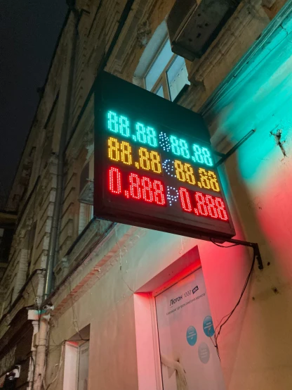 a sign for the time of 555 outside of an old building