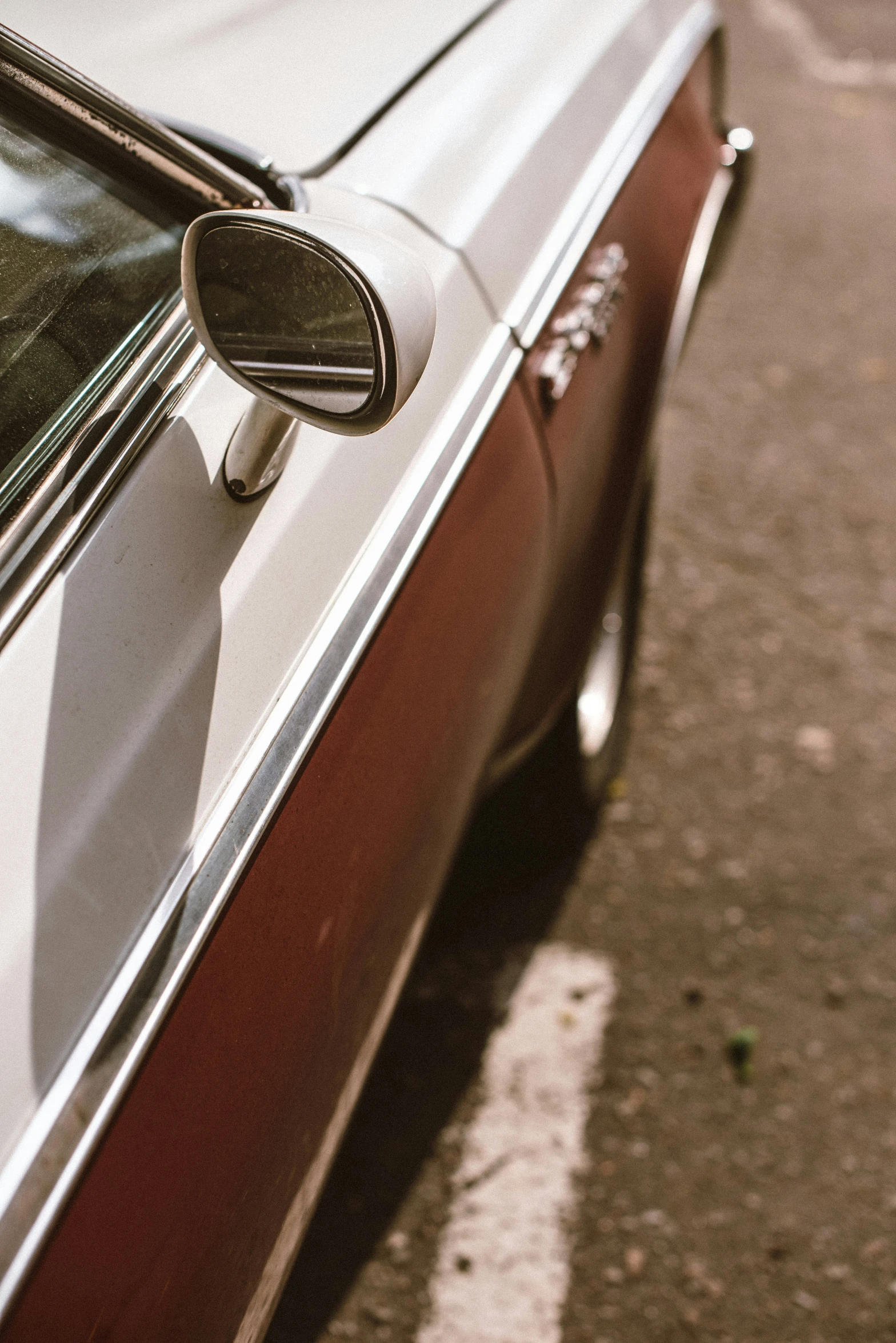 a close up of the taillight and window of a car