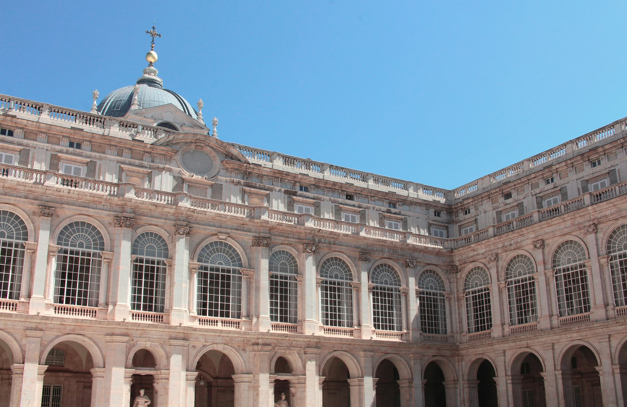 a building with a clock mounted on the front of it