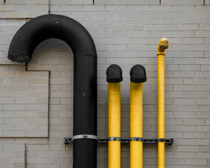 a couple of yellow pipes that are connected to each other